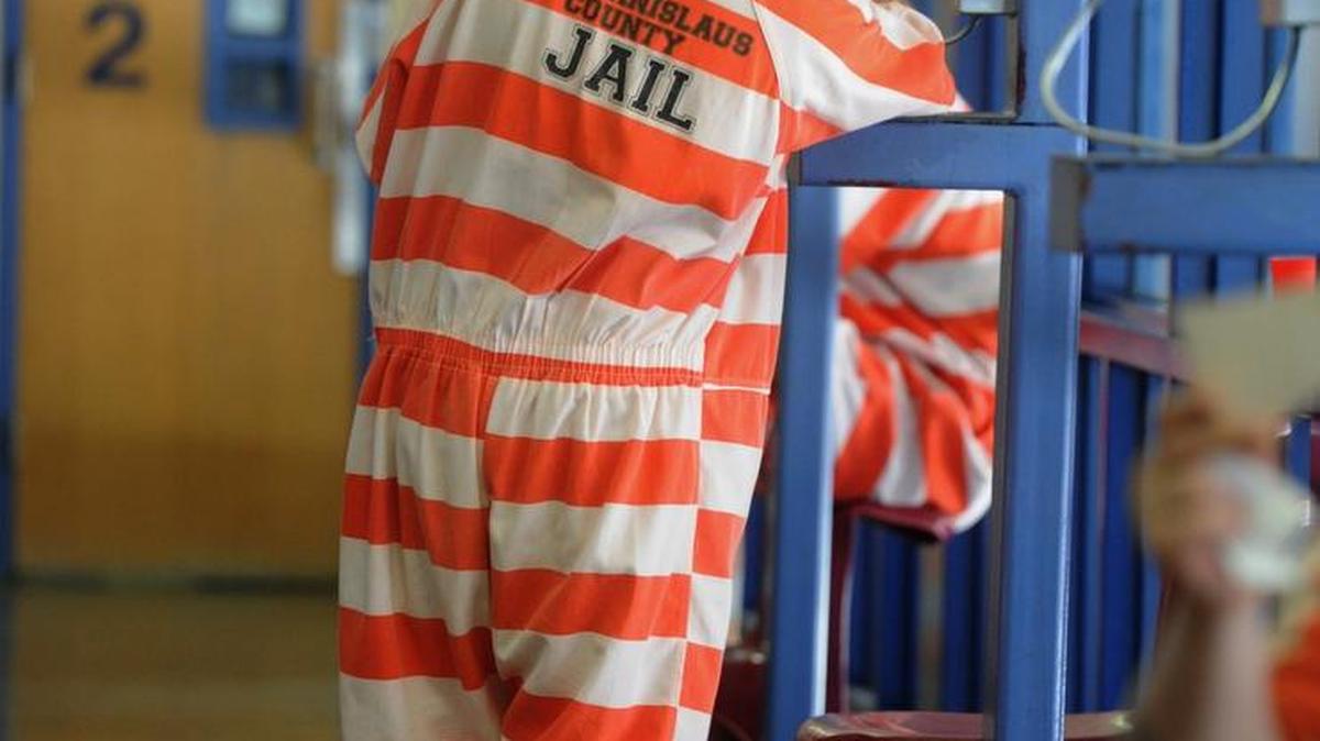 An inmate uses a telephone at the Stanislaus County Public Safety Center in May 2012.