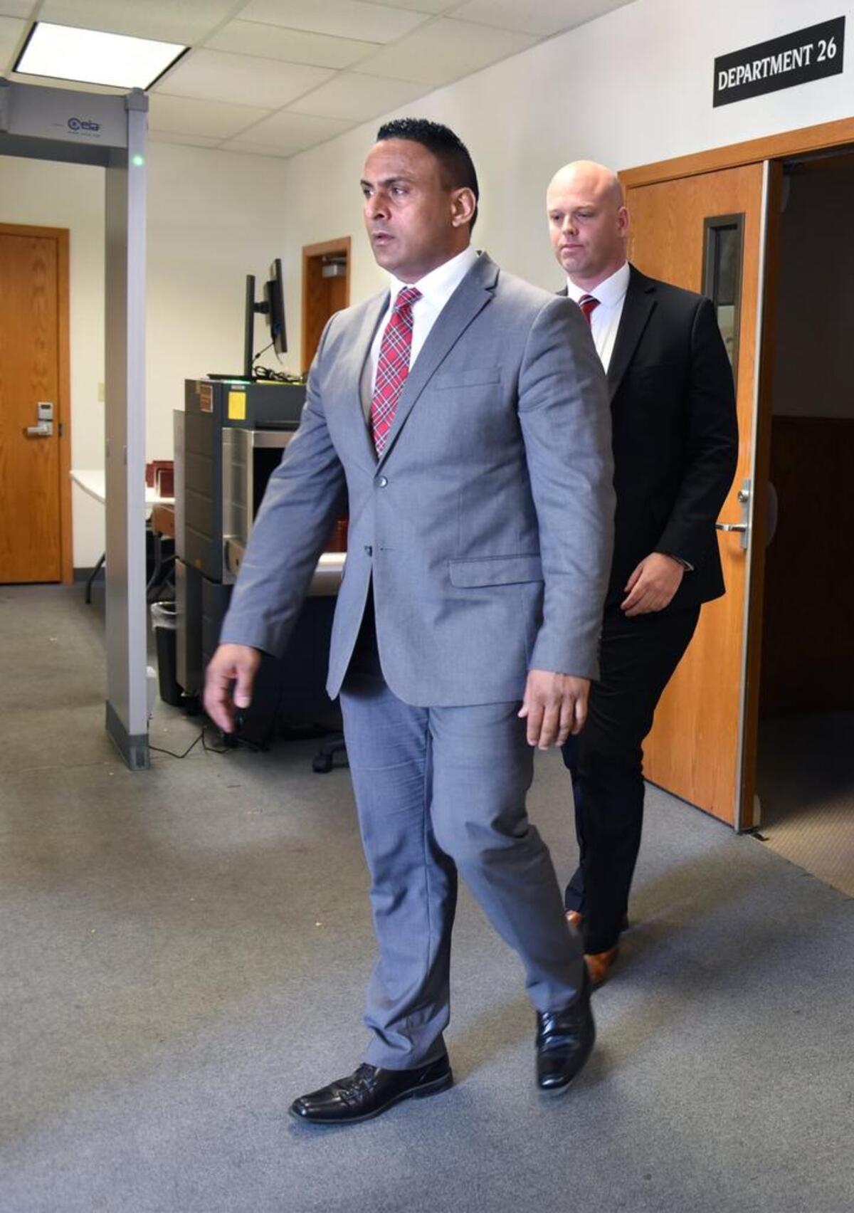 Daljit Atwal leaves court with his attorney Hans Hjertonsson (back) in April 2017.