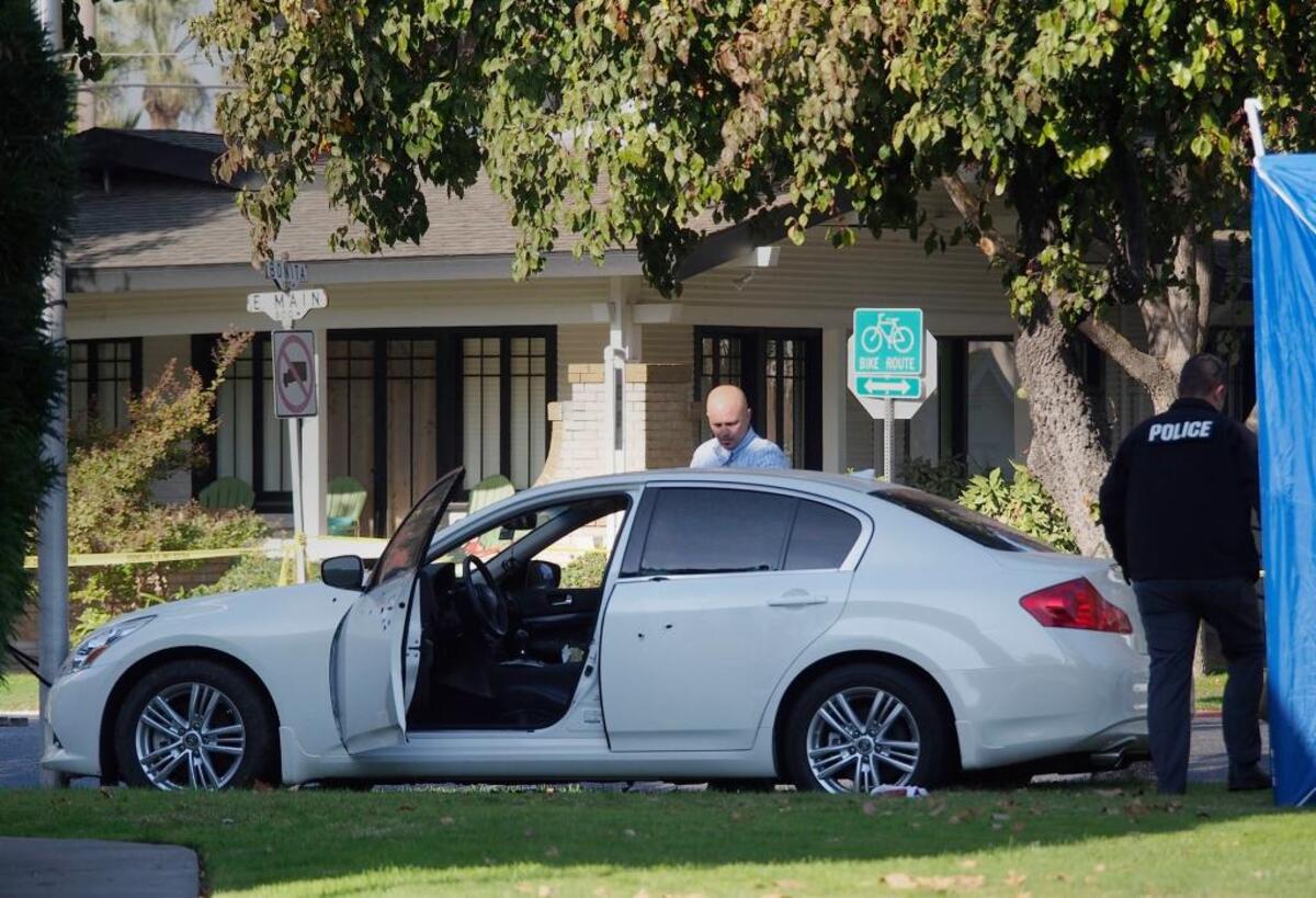 Turlock police investigate the shooting of Amritpal Sandhu, who was found dead in his white Infiniti on Nov. 6, 2013. The car came to a stop on the lawn of Good Shepherd Lutheran Church at East Main Street and North Minaret Avenue in Turlock.