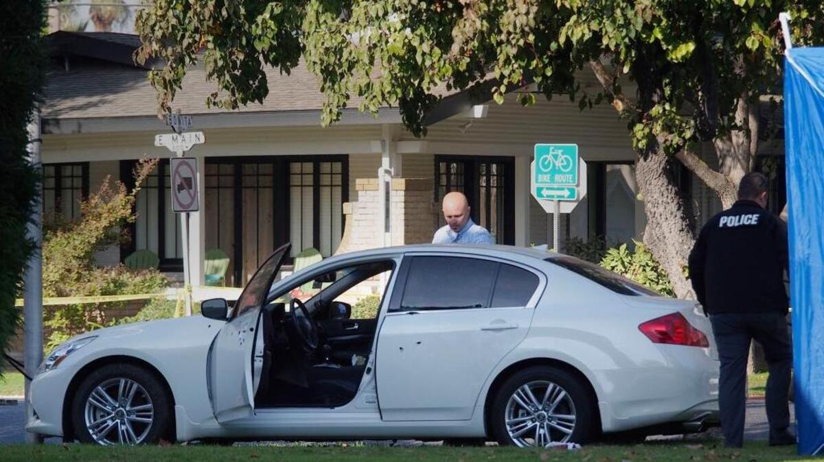 Turlock police investigate the shooting of Amritpal Sandhu, who was found dead in his white Infiniti on Nov. 6, 2013. The car came to a stop on the lawn of Good Shepherd Lutheran Church at East Main Street and North Minaret Avenue in Turlock.