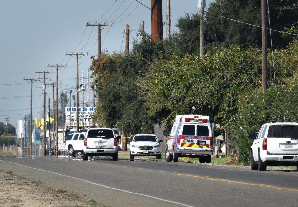 Deputies search a property on Rohde Road north of Keyes on Sunday, where witnesses say David Machado went after the shooting of Stanislaus County sheriff’s Deputy Dennis Wallace.