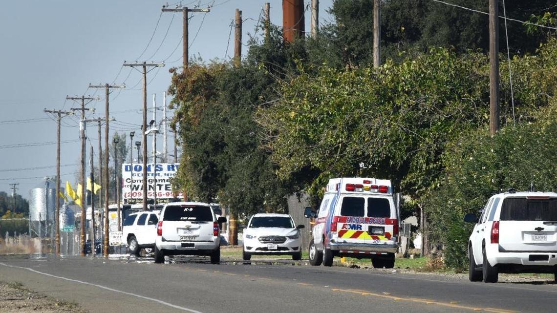 Deputies search a property on Rohde Road north of Keyes on Sunday, where witnesses say David Machado went after the shooting of Stanislaus County sheriff’s Deputy Dennis Wallace.