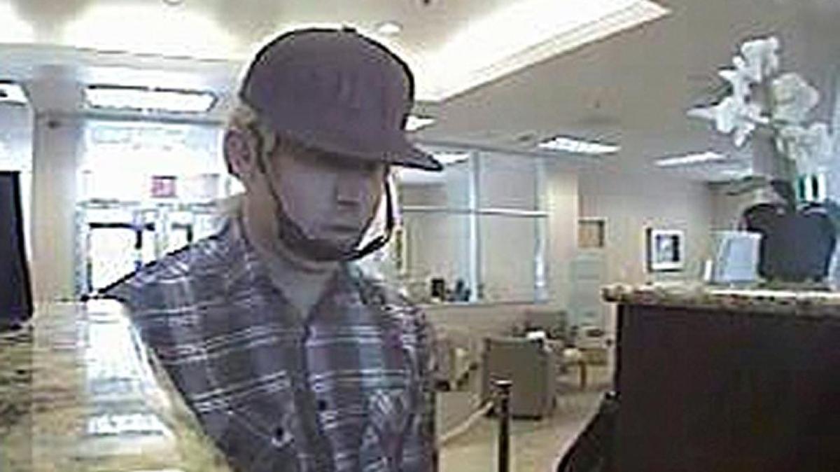 The Escalon robbery occurred about noon Monday April 18, 2016, at the BBVA Compass bank in the 3300 block of McHenry Avenue. The robber was wearing what appeared to be a bleached-blonde ponytail wig, a white-and-gray flannel button-up shirt, jeans and black baseball cap.