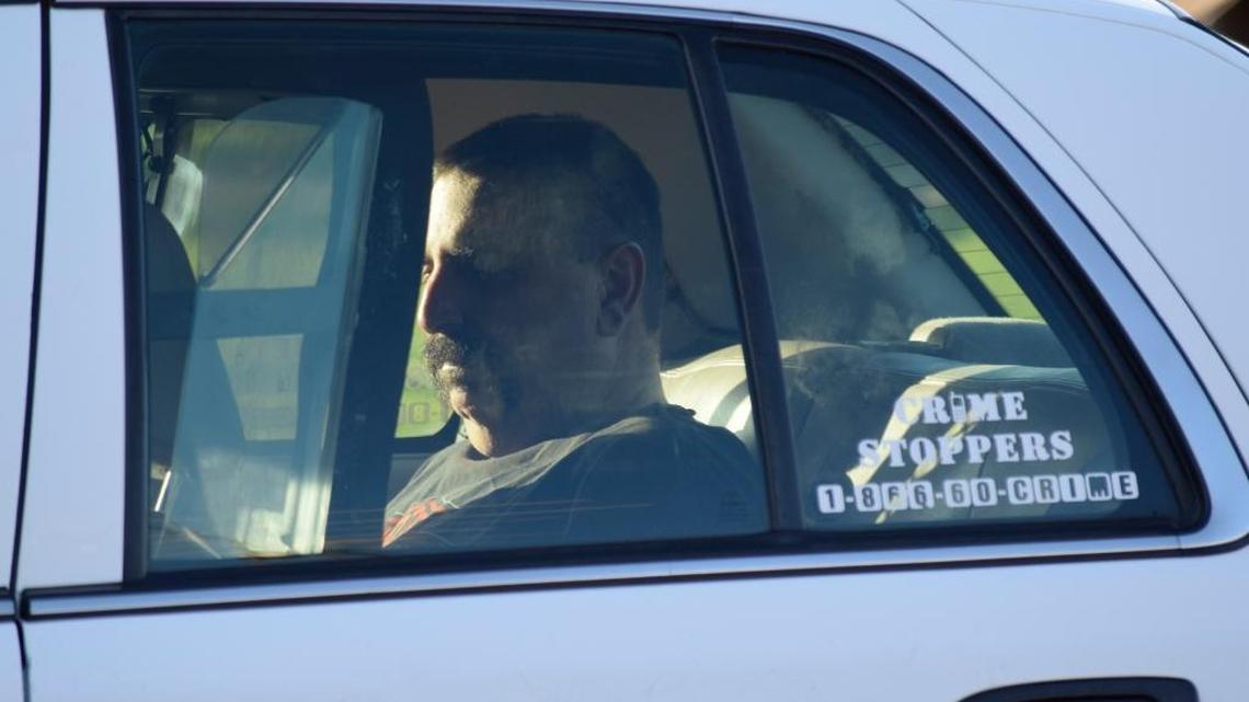 Phillip Turley sits in the rear of a Stanislaus County Sheriff’s Department car after 2016 stabbing.