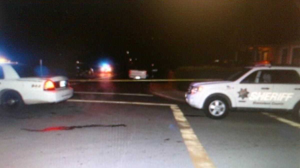 Stanislaus County Sheriff’s Department vehicles at the scene of a homicide on Church Street in Empire on Thursday night.