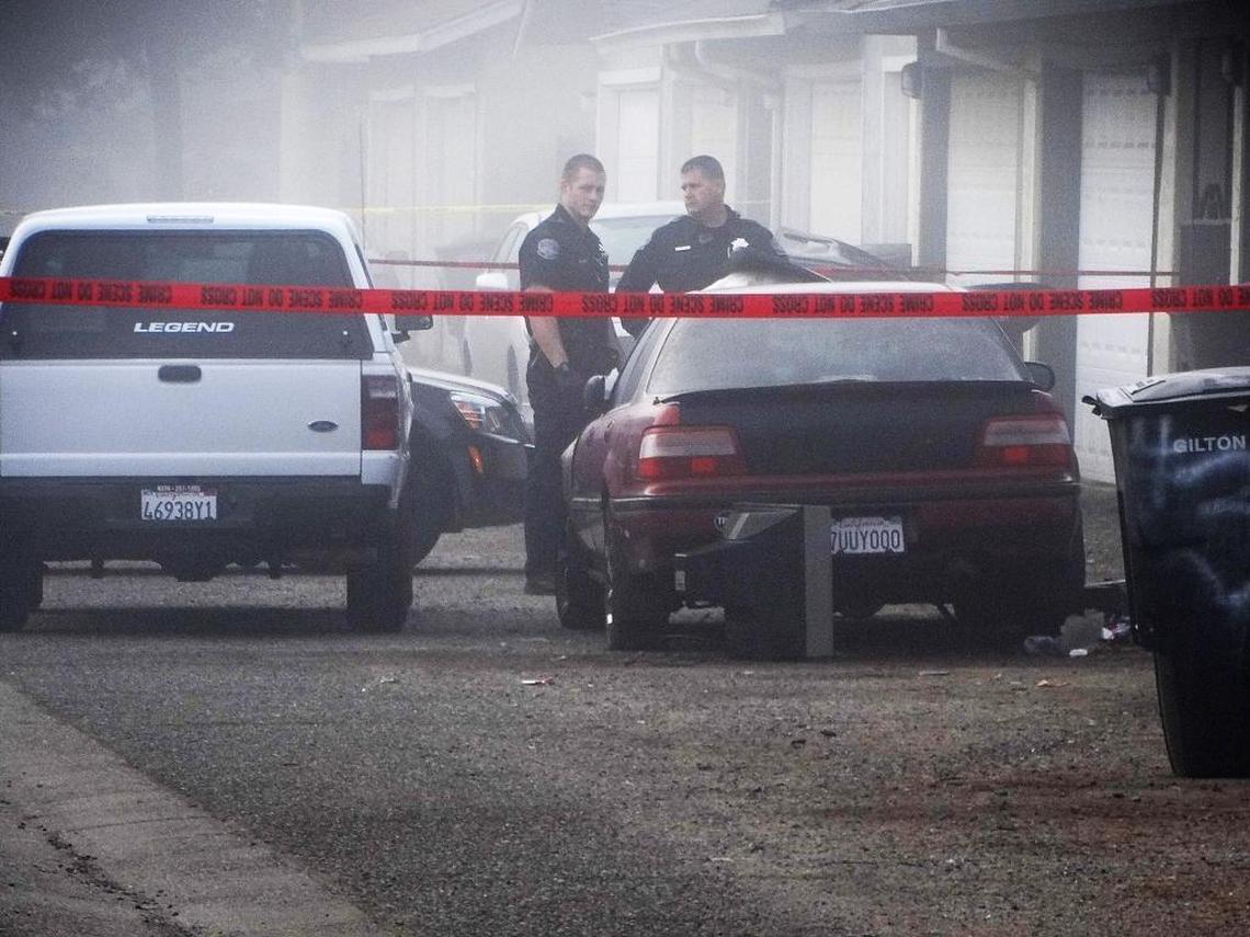 An officer-involved shooting incident Monday night, Jan. 30, 2017, in a residential complex on Maserati Drive in north Modesto left one man dead and a Modesto police officer with a head injury. Police work the scene in the fog Tuesday morning.