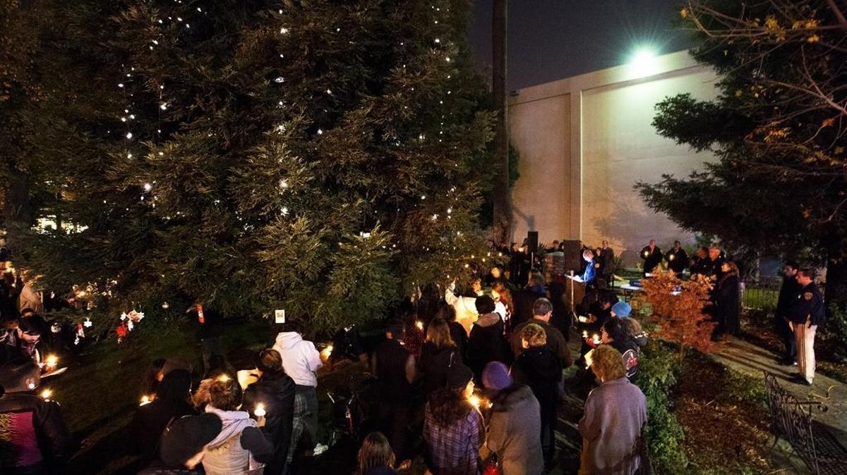 Modesto police Chief Galen Carroll reads the names of homicide victims during the annual lighting of the homicide victims’ memorial tree and candlelight vigil outside the Stanislaus County Courthouse in Modesto in December of 2013.