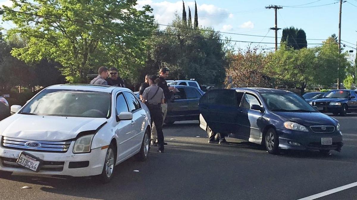 Modesto Police Department officers survey the scene after a suspect in an Oakdale shooing last year was arrested on Oakdale Road just north of Merle Avenue after he crashed his vehicle following a pursuit on Tuesday, March 21, 2017.