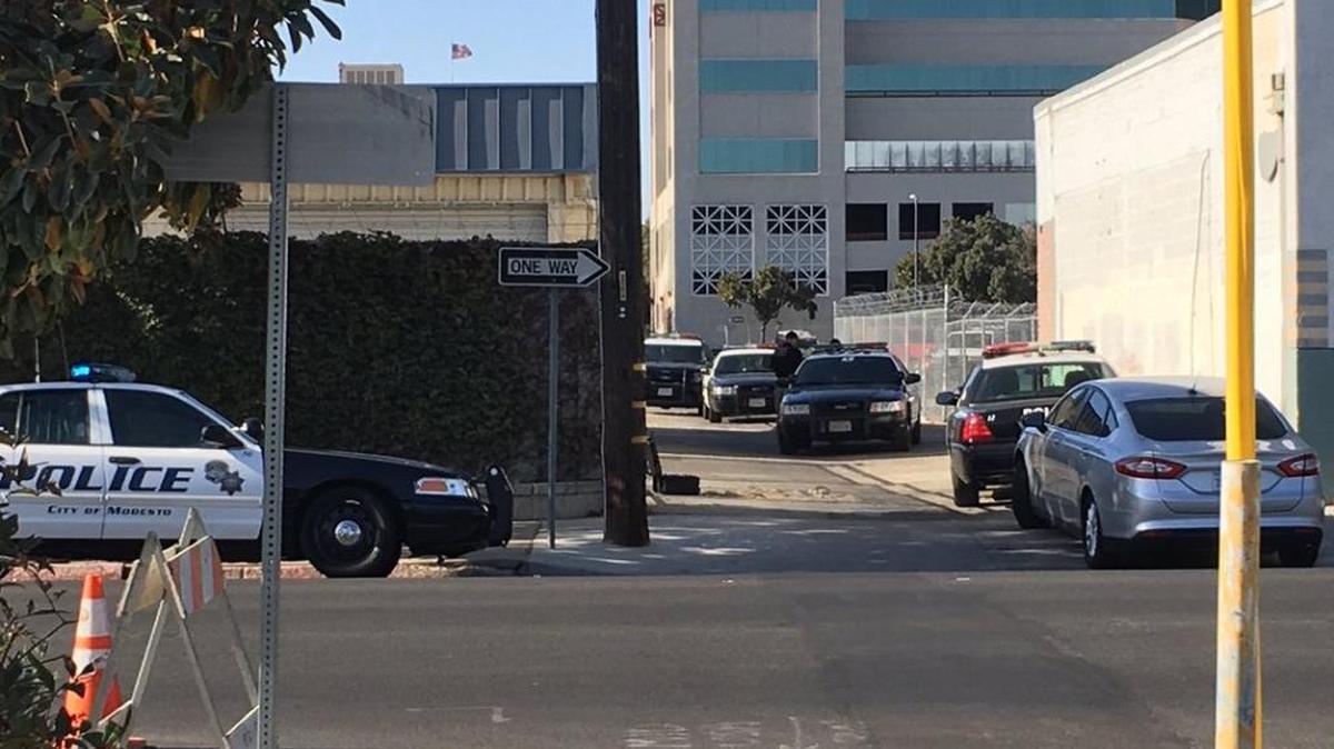 Modesto Police searched the vacant buildings across from the police department in downtown Modesto Thursday afternoon (10-12-17) after a man bleeding from the head was found in an alleyway there.