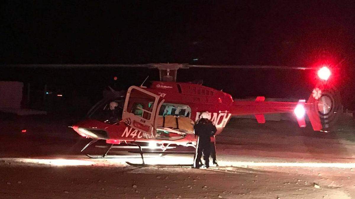 A 19-year-old woman found stabbed along Tesla Road east of Livermore is loaded on a helicopter early Monday. She was taken to a Castro Valley hospital, where she later died.