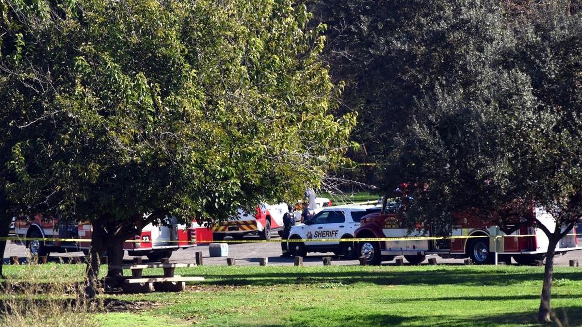 Law enforcement and emergency crews investigate the fatal shooting of a Stanislaus County sheriff’s deputy Sunday morning at the Fox Grove Fishing Access in Hughson.