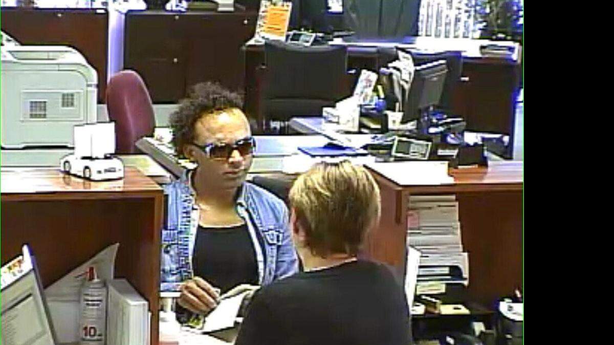 
Surveillance footage shows West America Bank being robbed.
