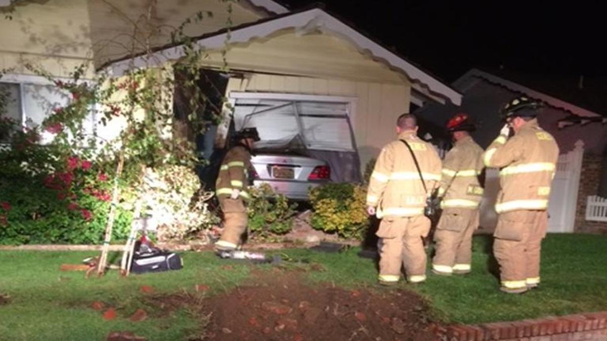 Ceres firefighters respond to a crash into a home on Caswell Avenue that pinned a man beneath the car early Thursday morning.