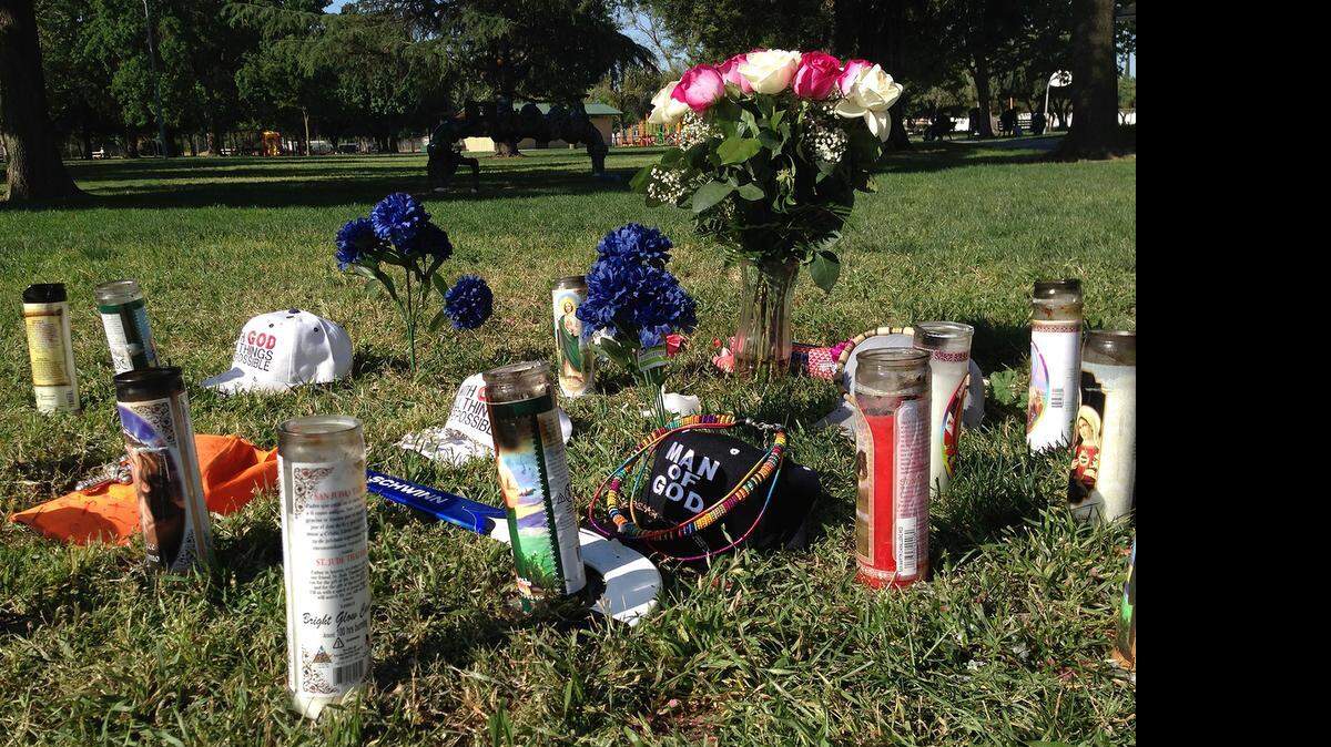 
A makeshift memorial for stabbing victim Robbie Hull Jr. rises in Mellis Park in Modesto on Monday. Hull was fatally stabbed in the chest Friday night by an attacker wielding a machete, Modesto police said.
