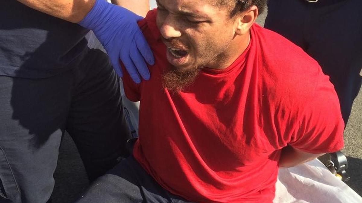 
Michael Tyler, of Lodi, is examined by paramedics after allegedly crashing a stolen car on the highway Tuesday (09-15-15) then breaking into a home to avoid arrest.
