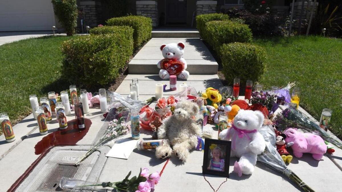 A memorial stands at the home on Nob Hill Court in Modesto, Calif., where the bodies of two adults and three children were found in July 2015. Martin Martinez has been charged in the case.