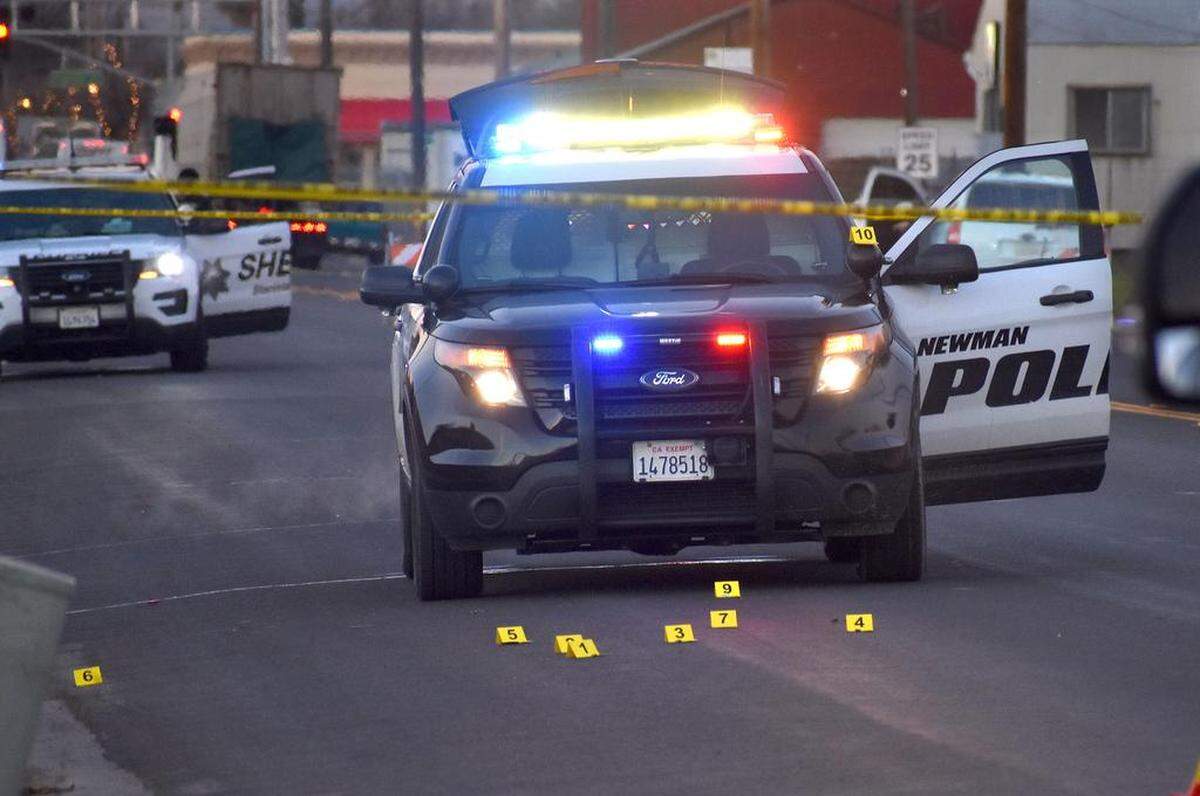 A Newman police officer, Ronil Singh, was fatally shot early Wednesday morning, Dec. 26, 2018, while conducting a traffic stop on Merced Street at Eucalyptus Avenue. Evidence markers sit in front of Officer Singh’s vehicle, and atop its spotlight.