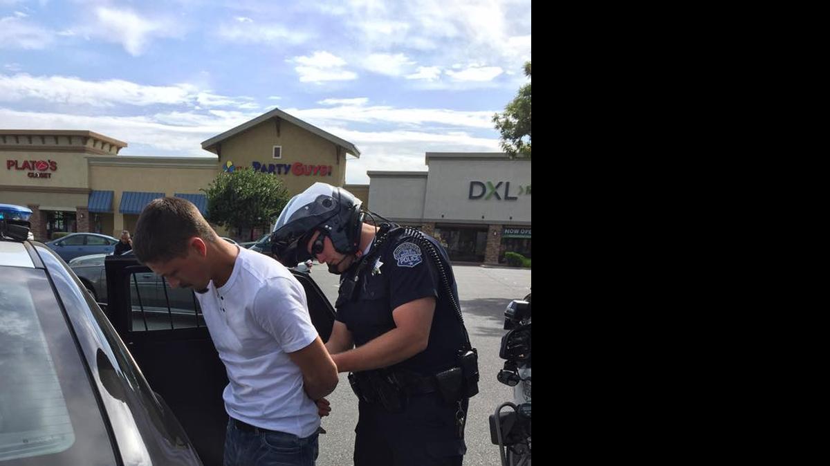 
Modesto police take into custody a vehicle theft suspect in the parking lot of the Big 5 Sporting Goods store on Dale Road on Wednesday morning.
