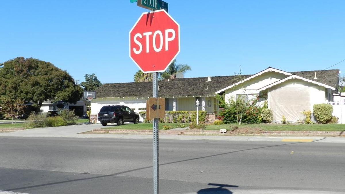 The driver of a stolen car blew through the Sixth Street stop sign and right across Caswell Avenue into a bedroom where a father and his 8-year-old son were sleeping Thursday morning. There are no skid marks to indicate the driver tried to stop. A tarp hangs in front of the boarded-up bedroom wall on the right side of the house.