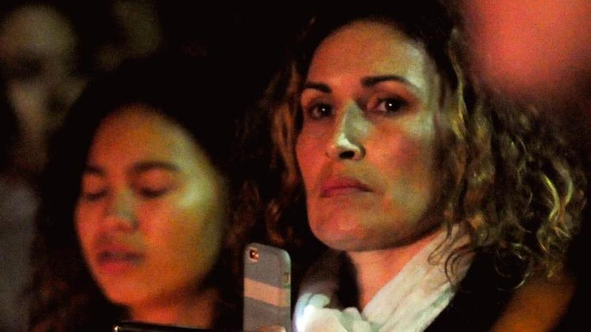 Alysia Gomez holds a photo of her son Damian Villavicencio, who was killed in 2013, at Lighting of the Homicide Victims’ Memorial Tree and Candlelight Vigil on the courthouse lawn in Modesto, California on Thursday Dec. 10, 2015.
