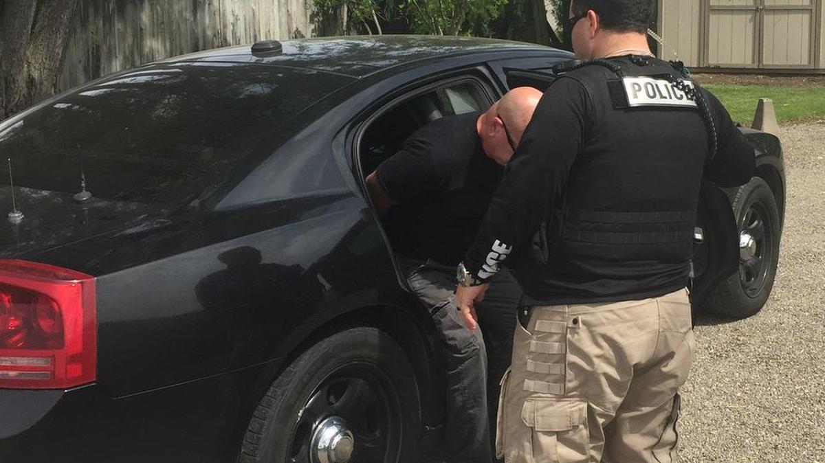 Authorities take Kevin Andrew McManis into custody on suspicion of possessing child pornography Thursday, April 21, 2016.