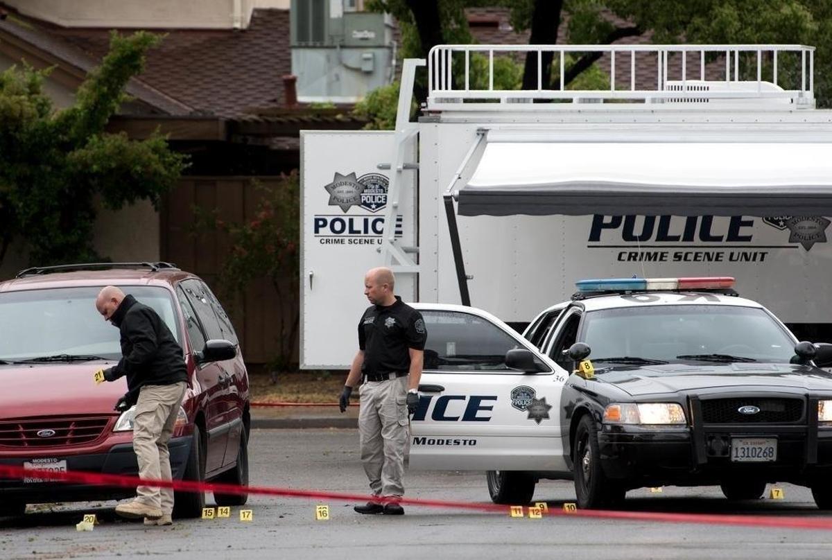 Modesto police investigate the scene of an officer-involved shooting on Lance Street in Modesto, Calif., on Sunday, April, 10, 2016