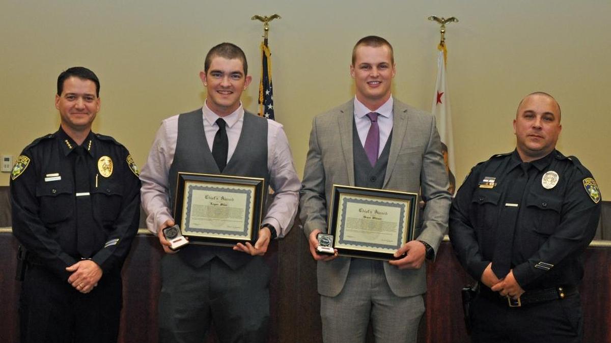 Two men were honored by Ripon police Chief Ed Ormonde on Wednesday, Dec. 23, 2015, for their actions during a violent attack on one of their friends. Grant Widmer, of Lathrop, and Logan Miller, of Oakdale, wrestled a sawed-off shot gun away from a man who assaulted and tried to kidnap and rape their friend in the parking lot of the Ripon Bike Bridge in June 2014. From left, Ormonde, Miller, Widmer and Detective Gordon West.