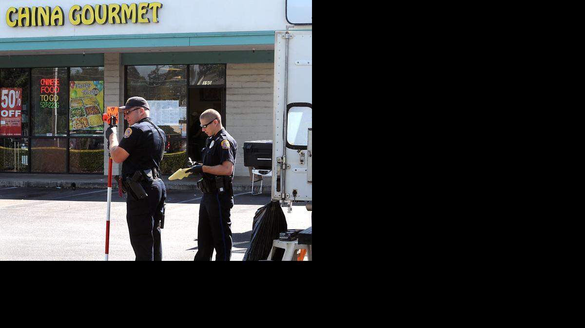 
 Modesto Police officers work the scene of a homicide in May 2011 at China Gourmet restaurant in Century Center in Modesto.
