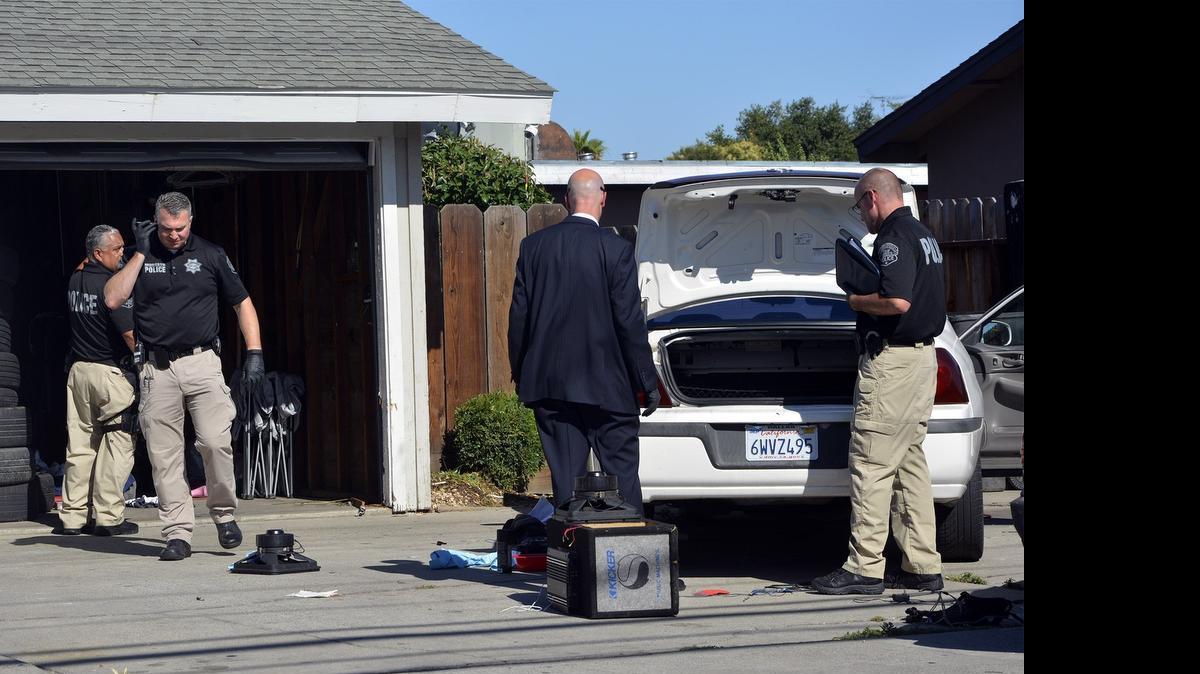 
Modesto police investigate a garage where homicide victim Kenneth Sedra Jr.’s body was found June 16 in the 3100 block of Coffee Road.
