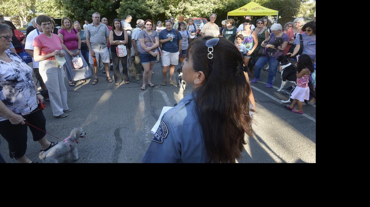 
Modesto police Crime Prevention Unit officer Rosie Garcia talks with owners and their dogs at the informative meeting at the Modesto Dog Park in July 2014 on how to effectively observe and report crime while walking your dog.

