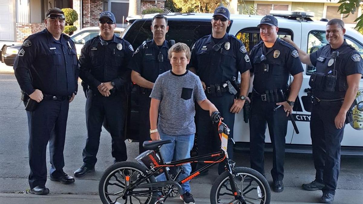 After Josh Taylor called 911 to report his bike stolen Wednesday morning, officers responded and searched but were unable to locate the person who stole it. Officers were impressed with Josh’s presence of mind when he called 911 immediately after the theft and provided a description of the bike and the thief, so they took up a collection at the department and surprised the boy with a replacement bike Wednesday afternoon, Oct. 19, 2016.
