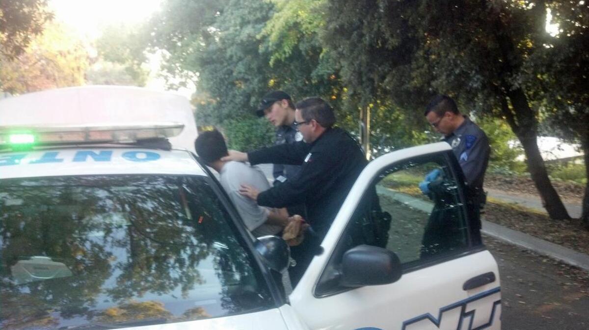 Jose Cruz, 21 is taken into custody after allegedly burglarizing a home in the 30 block of El Rio Avenue in Modesto, on Saturday, Nov. 21, 2015.
