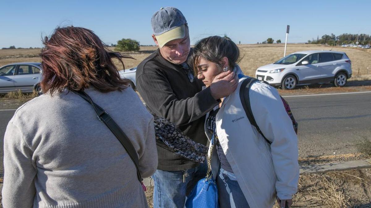 UC Merced student Dolly Gonzalez, 20, is comforted by father Andres and mother Esperanza after Wednesday’s stabbings.