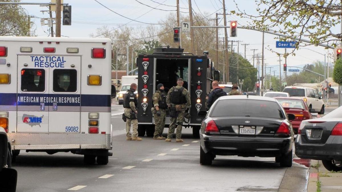 Law enforcement officers converge at Canal Drive and Geer Road in Turlock on March 20, 2013, for one of a series of sweeps in Turlock, Ceres and Modesto. The two gang members sentenced Monday and a third sentenced last month have been in federal custody since they were arrested along with 12 others during these sweeps by federal and local agencies targeting the Nuestra Familia gang and its street-level gang, the Norteños.
