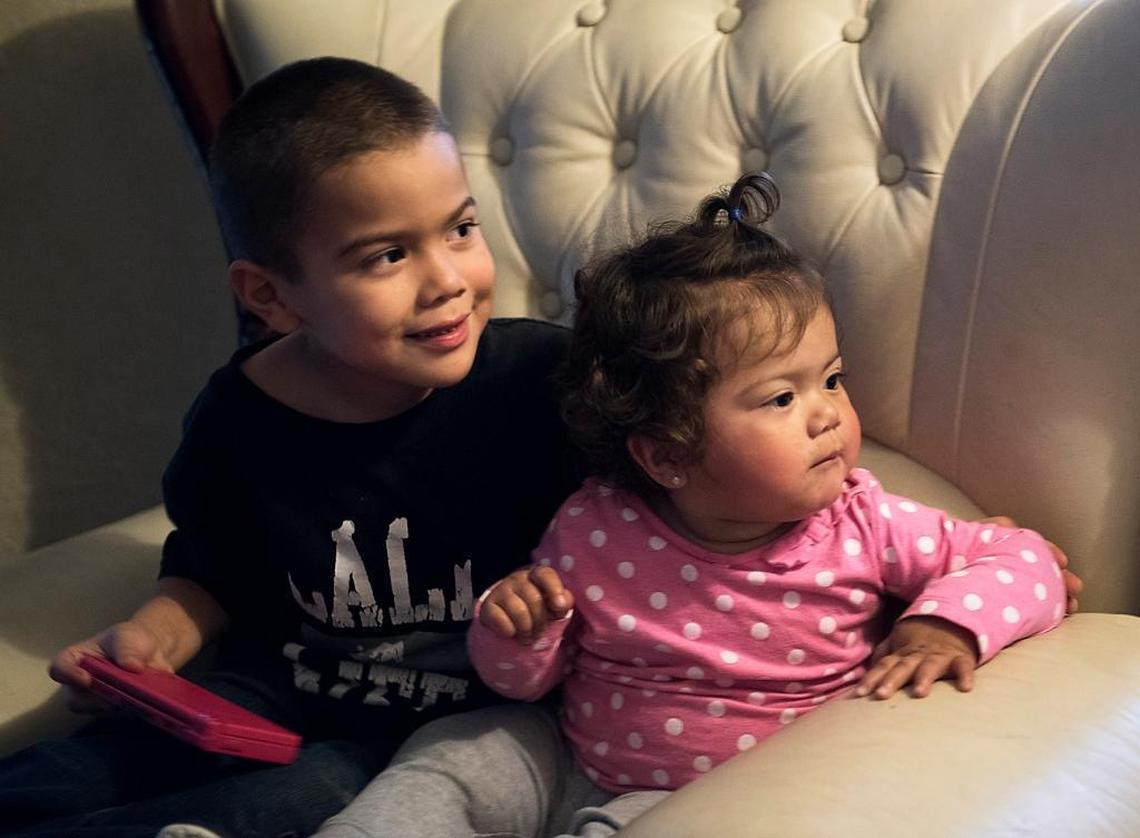 Andrea Castro’s children – Alexis, 5, and sister Jayleen, 1 – play at the home of Maribel Martinez in Modesto on Monday, Jan. 25, 2016.