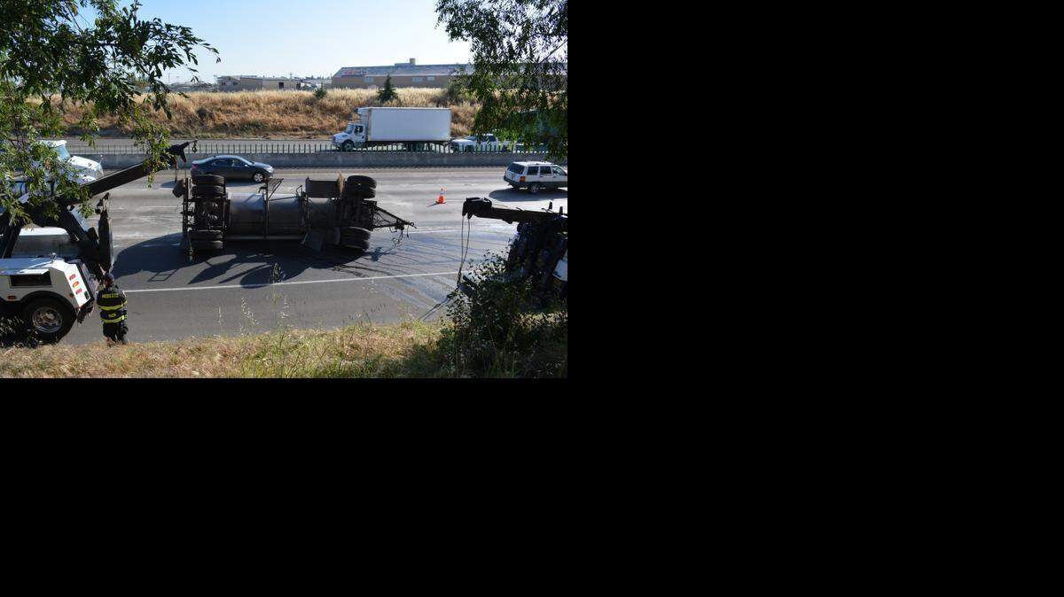 
A milk tanker overturned as a Foster Farms rig entered Highway 99 from Kansas Avenue on Monday. The accident slowed southbound traffic for about two hours.
