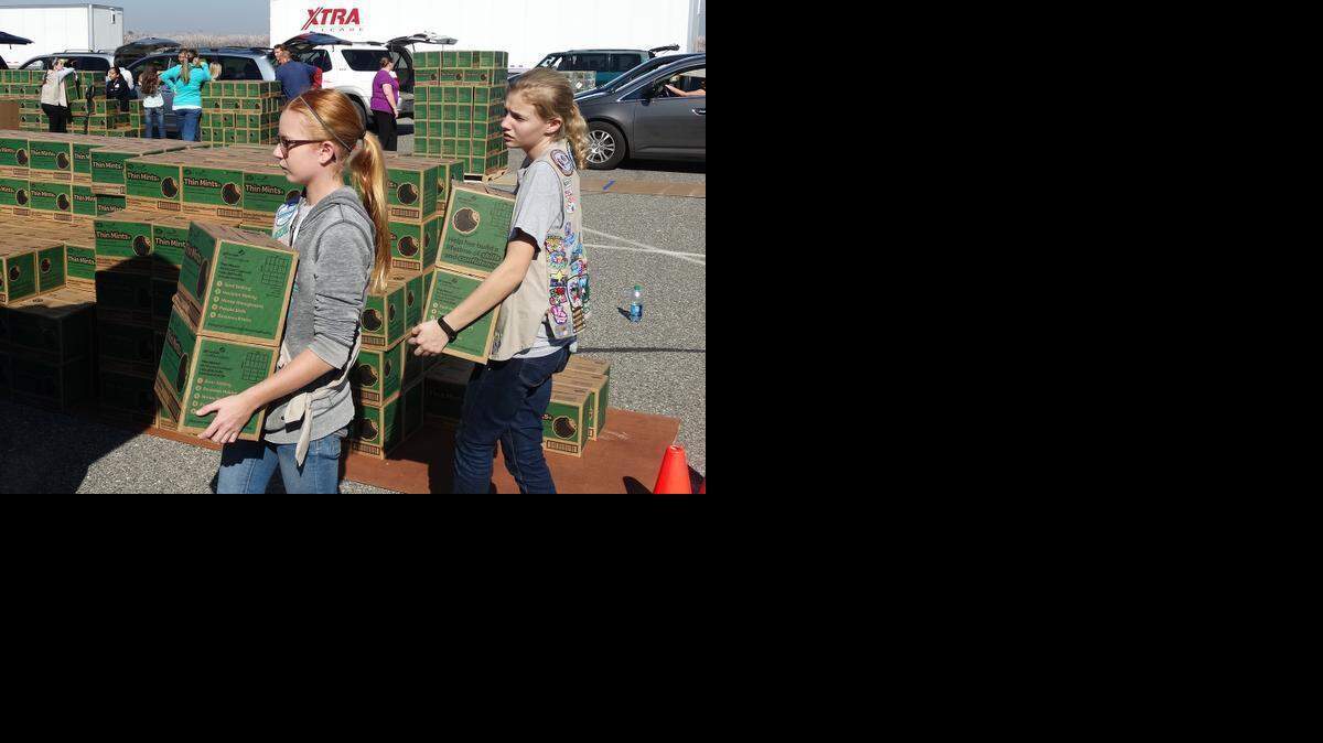 
Kaylee Vecchioni, left, and Samantha Goudy, both 13-year-old Cadet Girl Scouts with Troop 3761 of Waterford, volunteer at the Girl Scout Cookie Mega Drop on Monday, Feb. 16, in the parking lot at Big Valley Grace Community Church on Tully Road in Modesto.
