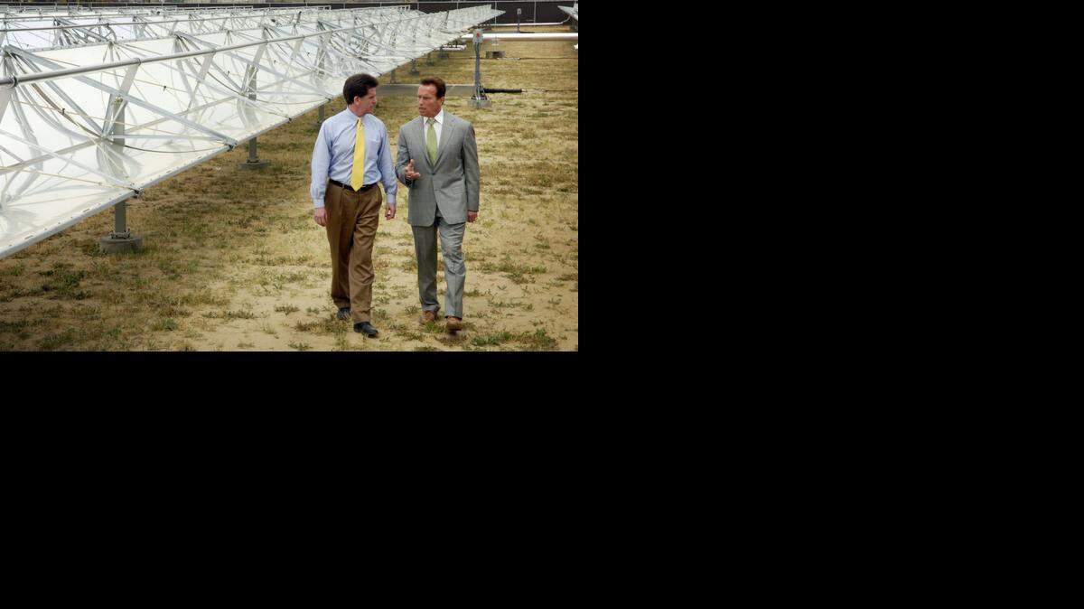 
Former Frito-Lay CEO Al Carrey and former Gov. Arnold Schwarzenegger walk beside the company’s solar panel operation in 2008. Frito-Lay has been certified by the Stanislaus Green Team for the steps it has taken to conserve energy.
