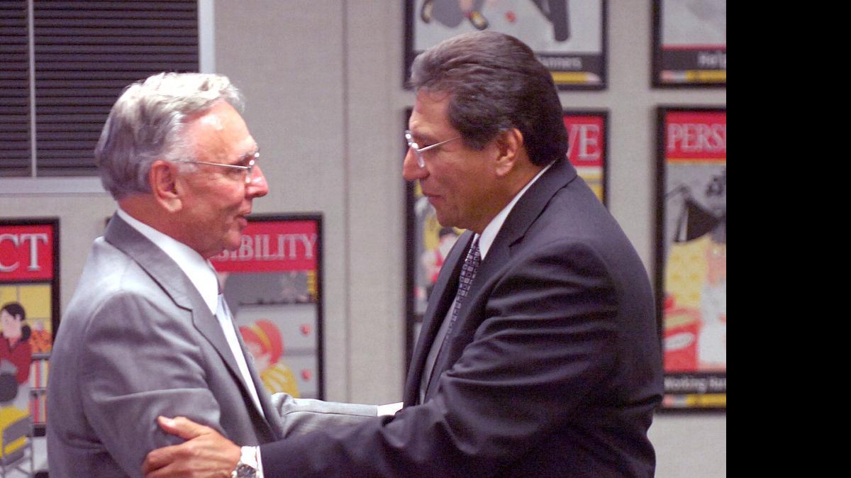 
At left, James Enochs, then superintendent of Modesto City Schools, congratulates his successor, Arturo Flores, in April 2007. Both are now retired, earning two of the top three educator pensions in the region.
