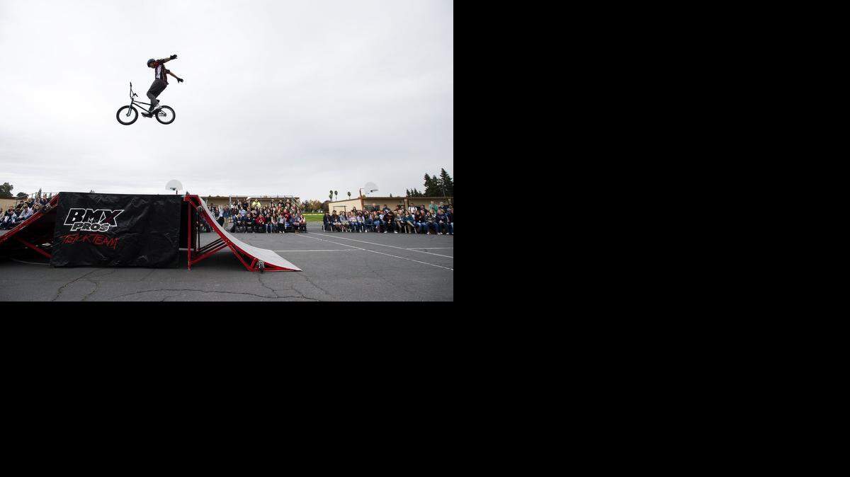 
BMX Pros Trick Team rider Dustin McCarty performs for Renaissance students at Beyer High School in Modesto, Calif., on Wednesday, Nov. 19, 2014.
