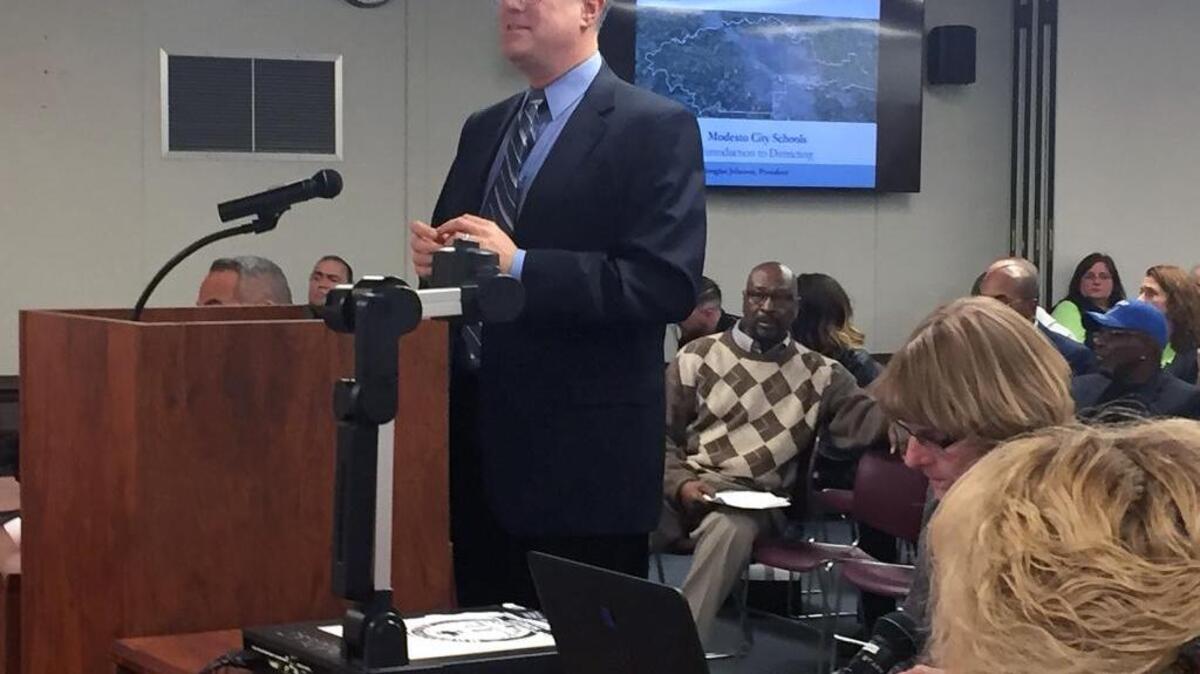 Douglas Johnson, president of the National Demographics Corp., gives the Modesto City Schools board information about the process of splitting into trustee areas Wednesday, pledging to get it done in time for November elections that will seat four on the seven-member board.