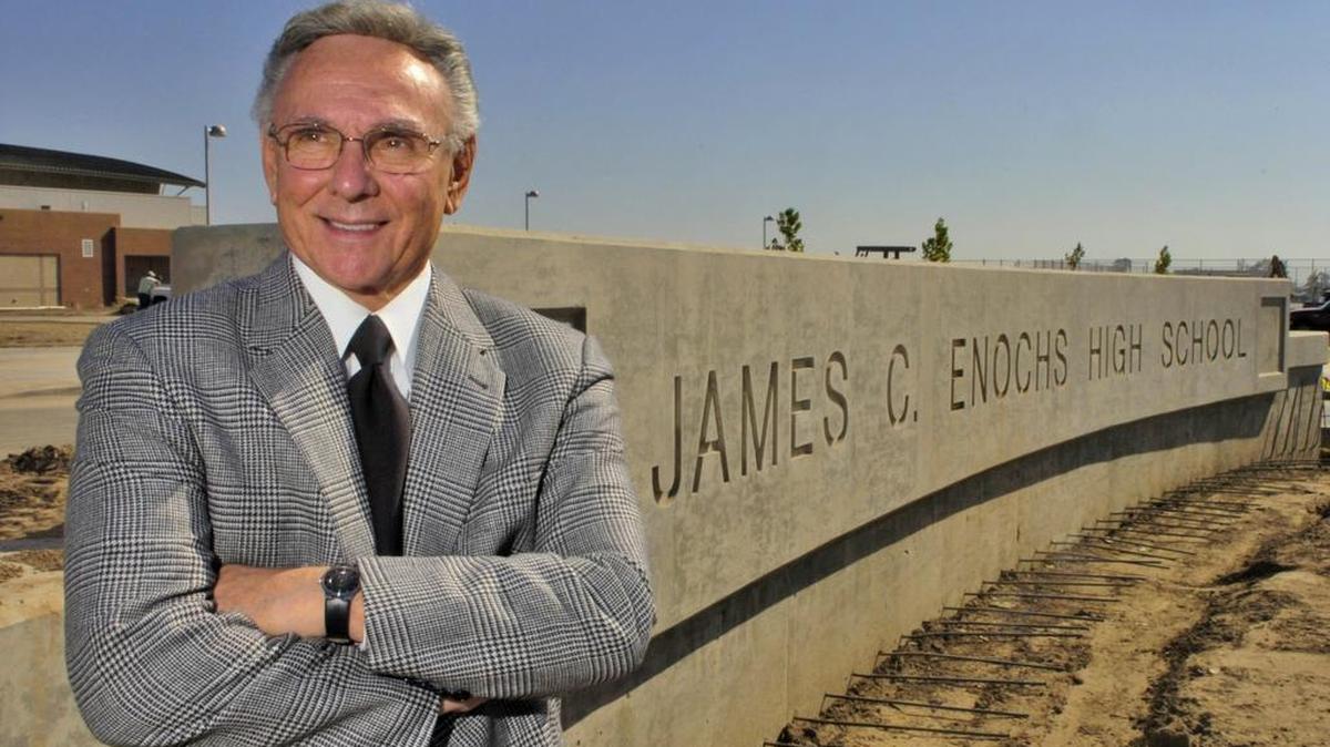 James Enochs, seen in August 2006 in front of the northeast Modesto high school named for him, was superintendent of Modesto City Schools for 21 years and an educator for nearly 50 years.