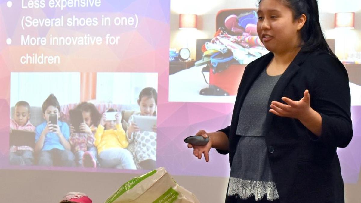 Patterson High student Flor Sanchez presents her business plan for Zip Up Shoes, children’s footwear with detachable soles that can fit with any number of uppers, during a Shark Tank-like scholarship competition in Patterson on Friday, March 3, 2017.