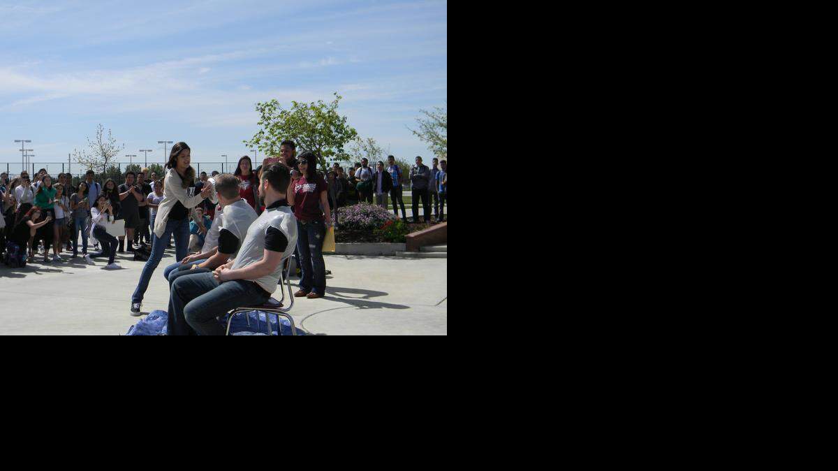 
Central Valley High School performing-arts director Elisabeth Konynenberg gets pied while other teachers await their fate on April 1 in Ceres.
