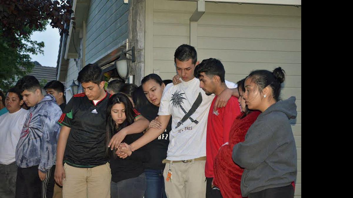 
Family and friends of Andy Vazquez gather on the front lawn of the Vazquez house in Salida, CA, to mourn the loss of the 16-year-old Gregori High student, who died after running during a physical education class on Monday, May 4, 2015. 
