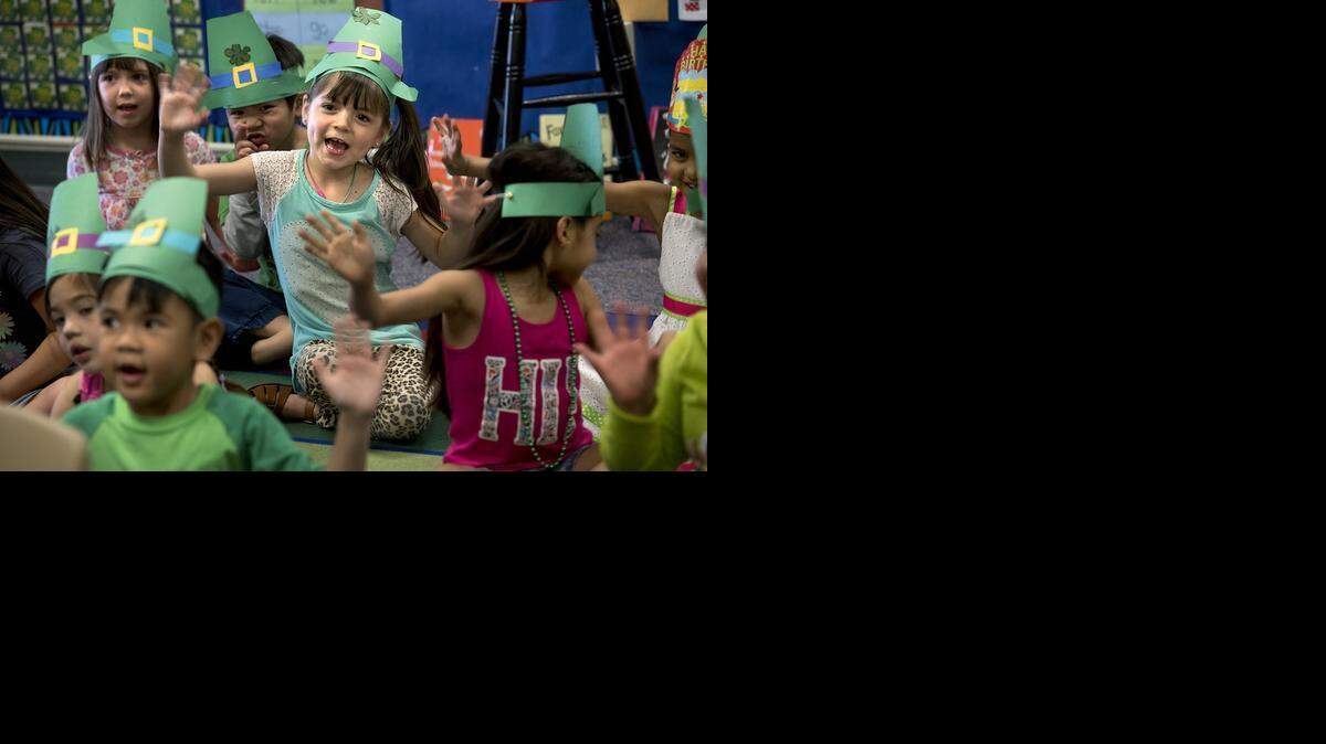 
Nayali Villano, middle, sings potato-themed songs with her kindergarten classmates at Martone Elementary School to celebrate St. Patrick’s Day in Modesto on Tuesday.

