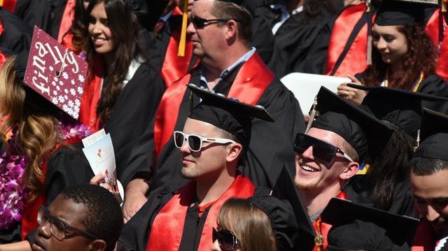 This May 27, 2016 file photo shows California State University, Stanislaus, graduates listening to speakers during their commencement ceremony at the Turlock, Calif. university. The university plans to hold in-person graduations in May 2021 with COVID-19 restrictions.