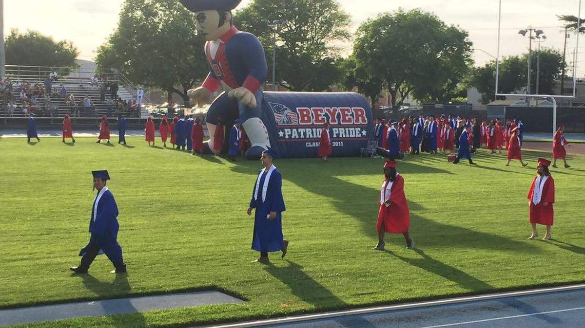 Graduates walk onto the field for Beyer High School’s graduation in Modesto, Calif. May 25, 2017