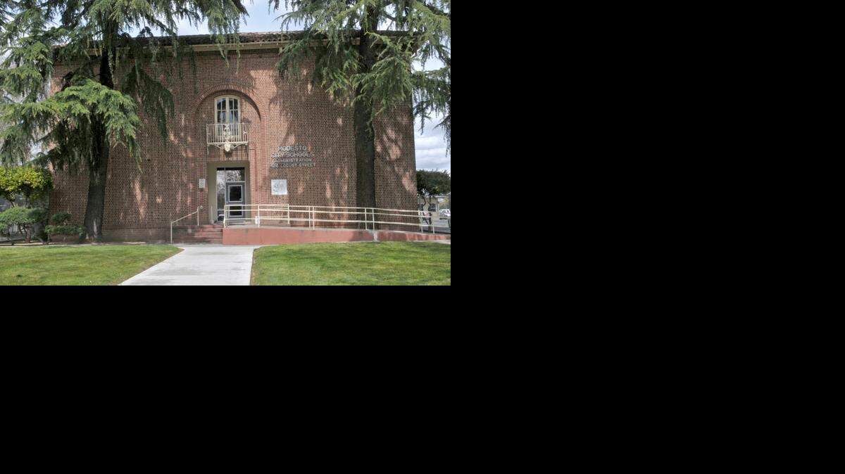 
The Modesto City Schools administration building on Locust Street will get a permanent addition to replace aging trailers and portable buildings in the adjacent parking lot. The building, built in 1923, has added a historical marker since this photo was taken in 2010.

