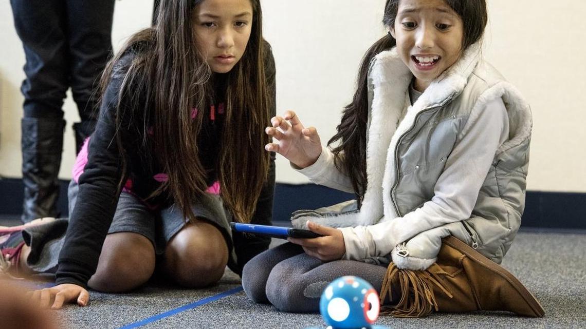 Denair Elementary Charter Academy third-graders Araceli Andrade, left, and Hilary Perez watch the result of their coding of the Dash robot during a class designed to introduce students to computer programming in Denair on Tuesday, Feb. 2, 2016. Students learned basic coding concepts to control a small robot. The program was taught by Jose Marquez, the Science Technology Engineering and Math coordinator for the Stanislaus County Office of Education.